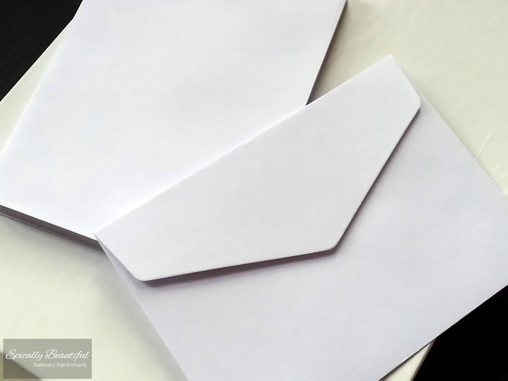 Photo of White V Flap C6 Peel and Seal Envelopes. Top Down View.